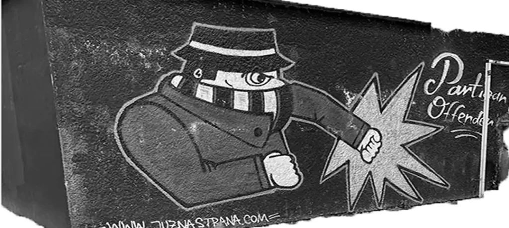 Grafiti en Belgrado del personaje "Partizan Offender" de los Grobari, inspirado en la estética Casual y el diseño de cómic ultra.